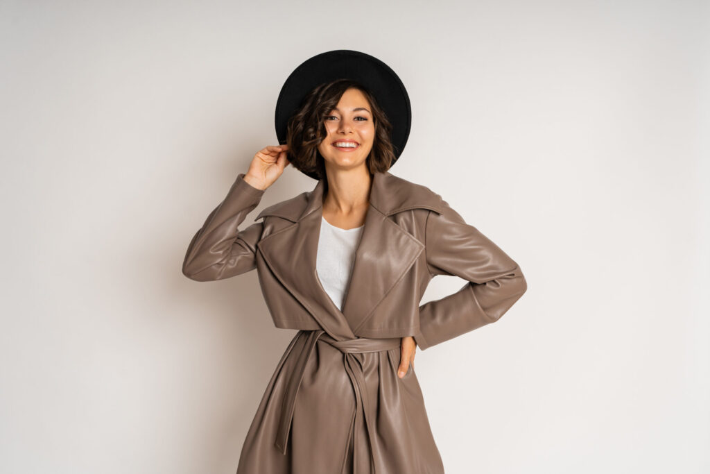 stylish woman leather coat black hat demonstrate winter fashion trends white scaled.jpg